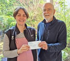  Roberta Gleaves of the Woodland Trust receiving a donation from Paul Sedgwick club president